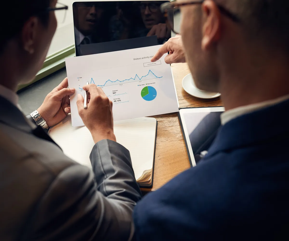 Founders reviewing investor research with an analyst